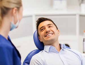 smiling patient visiting a cosmetic dentist in Virginia Beach
