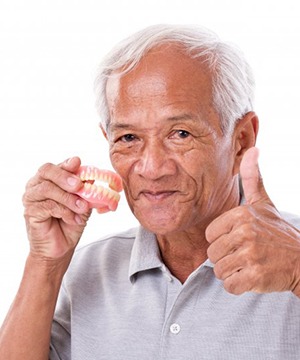 Man gives thumbs-up for dentures in Virginia Beach