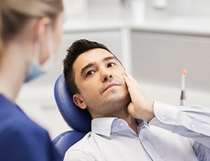 Man with toothache visiting emergency dentist in Virginia Beach, VA
