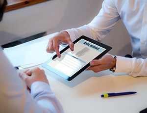 Patient reviewing dental insurance form on tablet