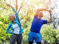 senior couple stretching before they exercise outside 