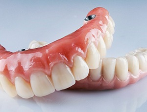 Implant dentures in Virginia Beach resting on table
