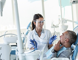 Implant dentist in Virginia Beach speaking with a patient