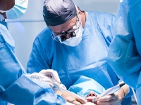 dentists performing dental implant surgery