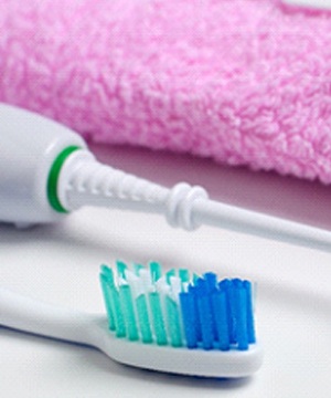 Oral hygiene products on counter.