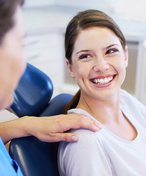 Smiling woman in dental chair