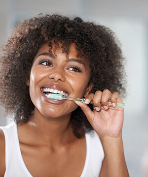 Woman brushing her teeth