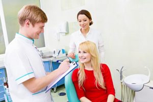 Woman in red at dentist