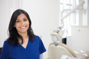 Woman smiling in scrubs