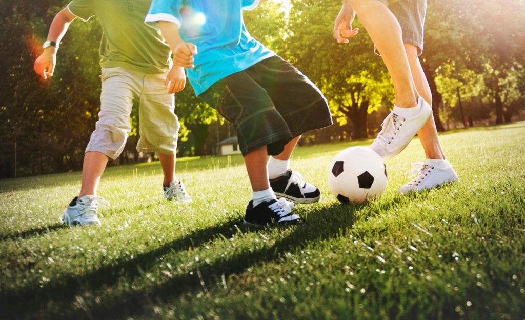 Children playing soccer.