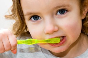 Young girl brushing teeth