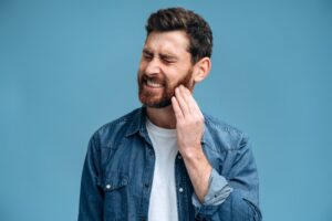 Man experiencing tooth pain